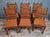 A set of six renaissance-style carved oak chairs dating from the late 19th century. these elegant chairs feature a richly...