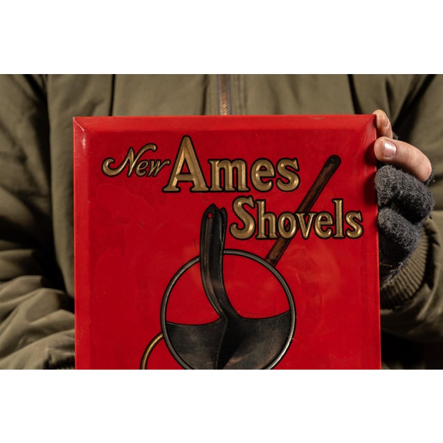 c. 1920s; Ames Shovel and Tool Company - Boston, MA Embossed lithographed tin advertising sign on a cardbord backing...