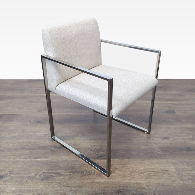 Linen upholstered armchair on metal frame. Brand: Brownstone. Dimensions (in): 21W x 22D x 32H.