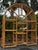 Vintage 1970s Arched Bamboo Étagère With Glass Shelves | Palm Beach Regency Coastal Bookcase For Sale - Image 10 of 11