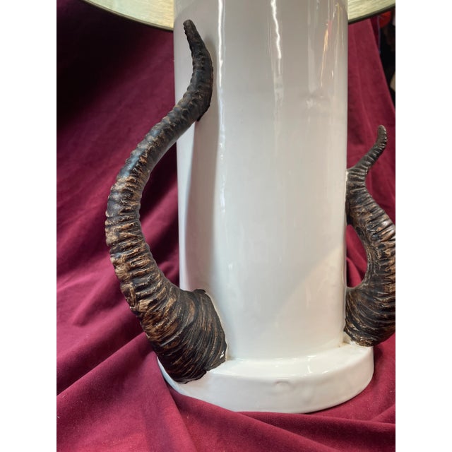 White ceramic lamp with ceramic horns in various sizes the white ceramic part is 17 inches tall. The lampshade is 18...