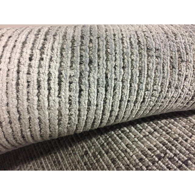 This wonderful new rug is in aqua with the end fringes complimenting the rug in silver to create this special look. Hand...