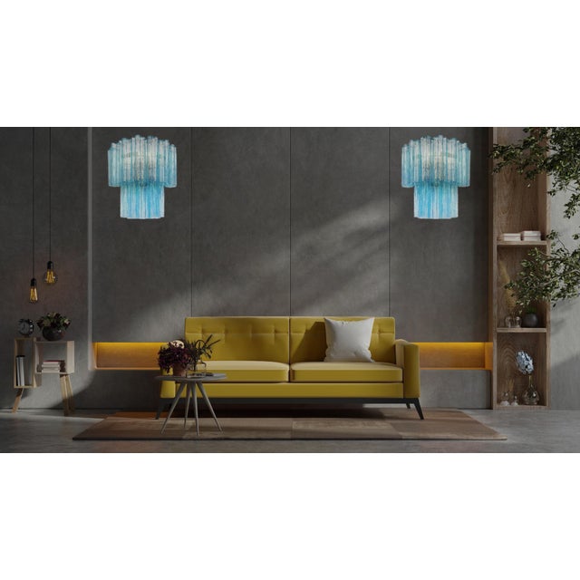 Italian vintage pair of wall sconces in Murano glass and nickel-plated metal structure. The armor polished nickel supports...