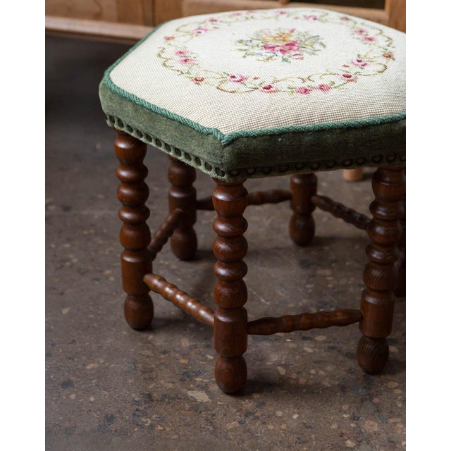 A compact Scandinavian beech stool from the 1950s, produced with the kind of restrained, purposeful design that made...