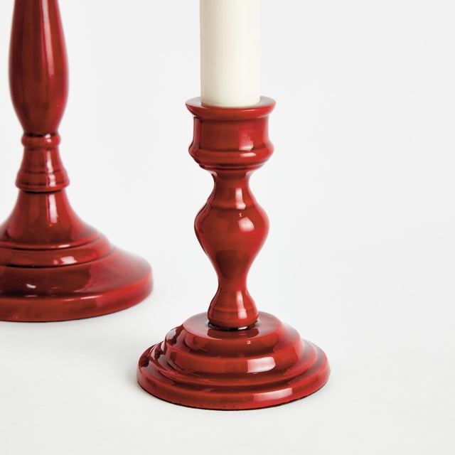 Traditional style in a contemporary fabrication, this set of vibrant red taper holders is designerinspired. Made of enamel...