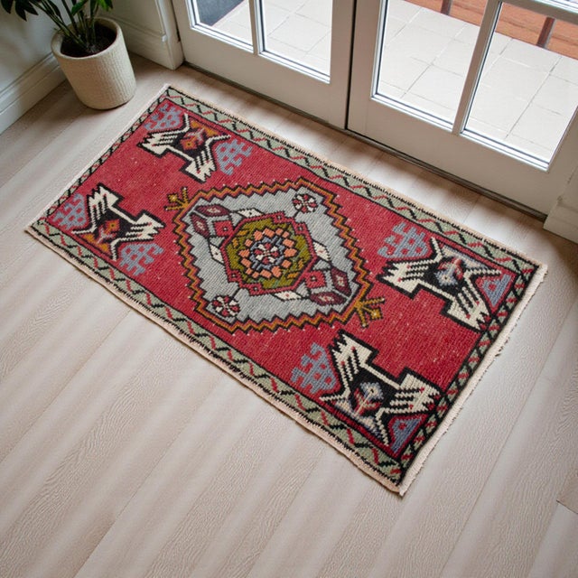 a Vintage Turkish Small yastik rug, vivid red color background yastik rug perfect for entryway, bath or in front of the...