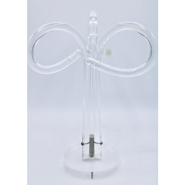 A superb vintage lucite towel rack or scarf holder. This is an excellent piece with a modern design.