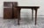 This is an elegant vintage Drexel Passage round extension dining table featuring beautifully figured mahogany veneer, a...