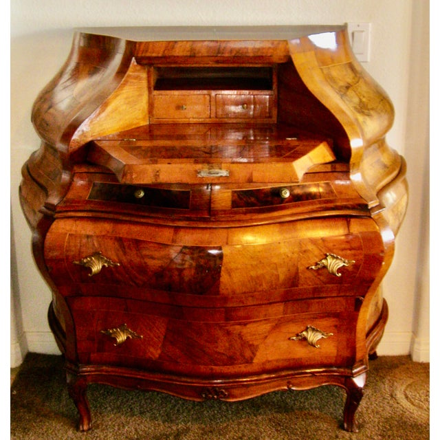 An exquisite 19th-century Antique Italian Rococo Bombe Secretary in burled walnut with bombe front & sides, front panels...