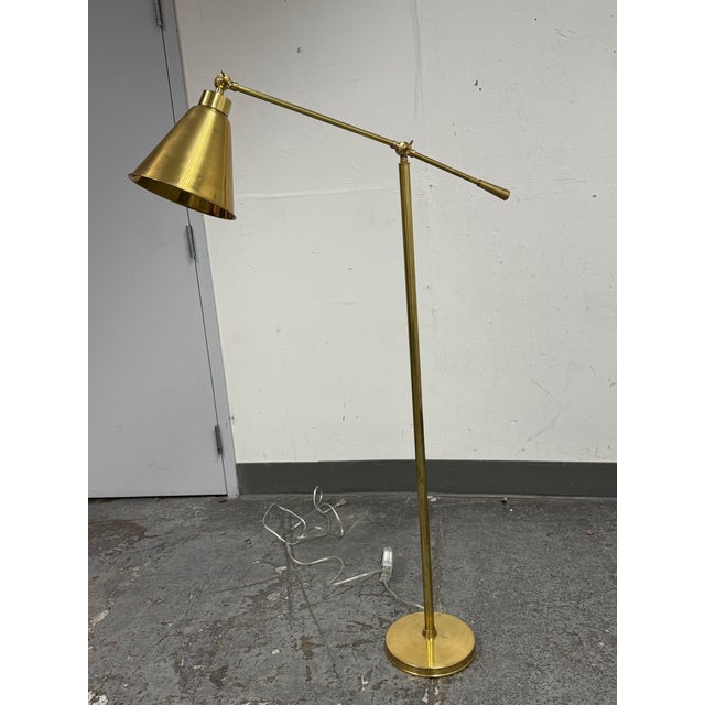 Design Plus Gallery presents the Claremont Brass Floor Lamp. This floor lamp by Serena & Lily has a brass tone metal frame...