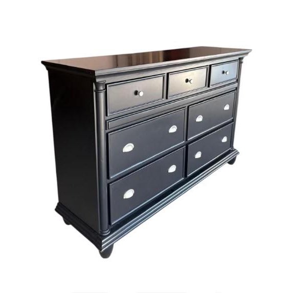 Black bedroom dresser made of solid wood with chrome pulls. The top is in good condition. The brand is Chris Madden for...