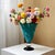 This hand-blown glass vase seals the flowing lake blue texture in the transparent glass body, and the swirling smudged...