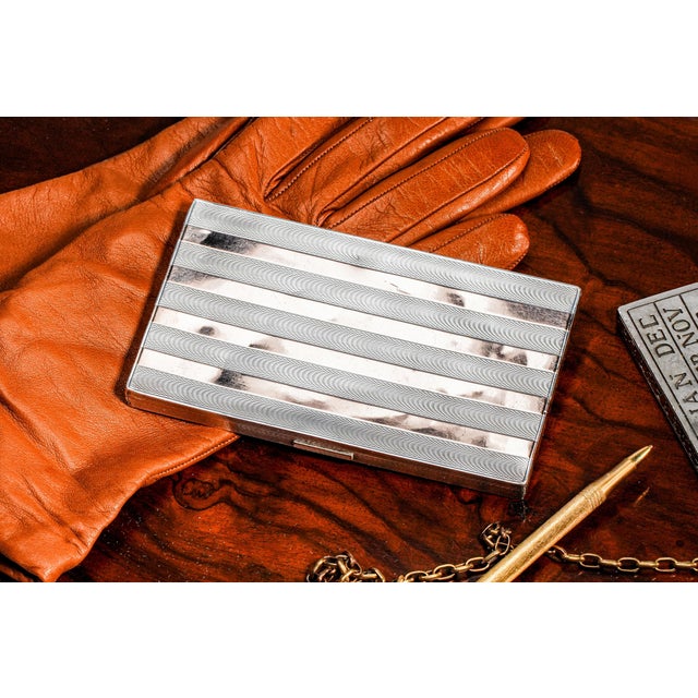 A striking expression of Art Deco elegance and craftsmanship, this exceptional sterling silver and 14k gold case embodies...