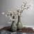 This pair of slender ikebana vases features an elegant, slightly flared neck and a beautifully balanced, pear-shaped body....