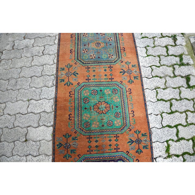 This is a vintage Turkish Oushak rug from the 1960s. The piece was hand-knotted.