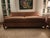 William Alan custom designed pair of caramel colored mohair sofas. The front has three brass casters and 2 back legs which...