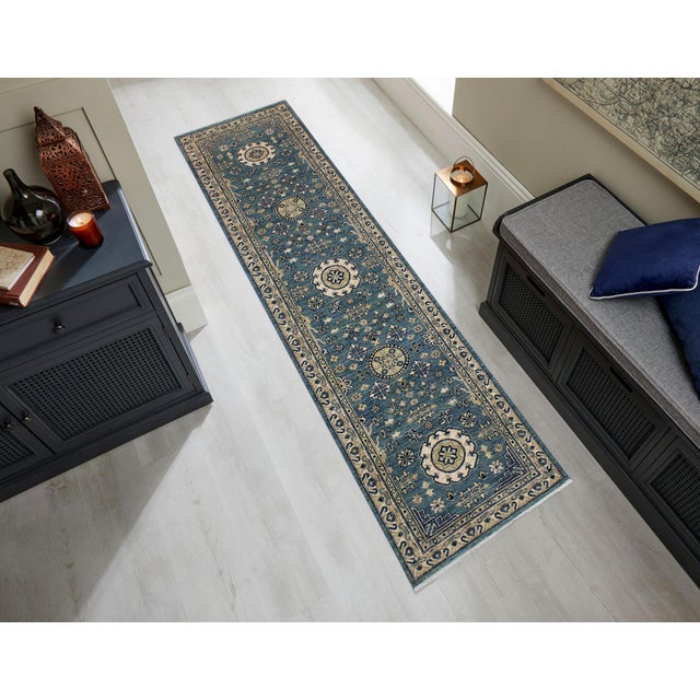 Enhance the ambiance of your home with this magnificent Persian-influenced Turkish hand-knotted rug made by skilled...