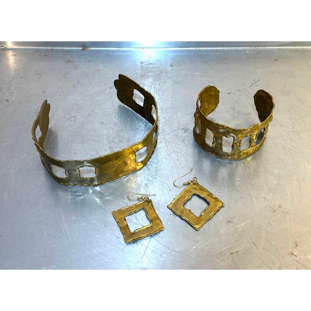 1960s-70s gladiator-style gold tone choker necklace, cuff bracelet and earrings. Both bracelet and choker are bendable for...