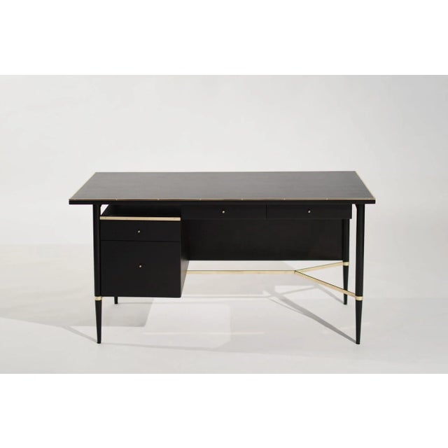 Ebonized Mahogany Desk from Paul McCobb's Connoisseur Collection, meticulously restored by Stamford Modern. Crafted in the...