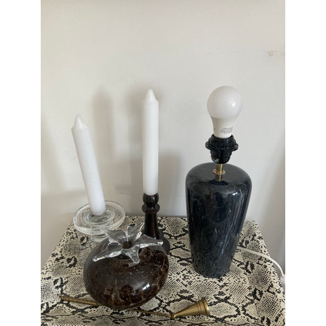 Post modern era marble lamp in black. Very heavy weight. Requires a uno fitter or clip on lamp shade. This lamp is truly...