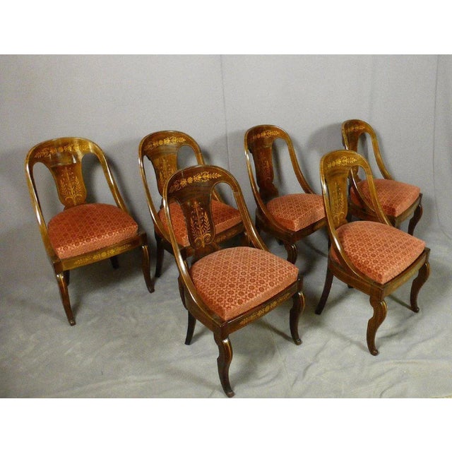 Rare set of six chairs Charles X bearing the stamp "Allard". The gondola shaped chairs rosewood inlaid with arabesques and...