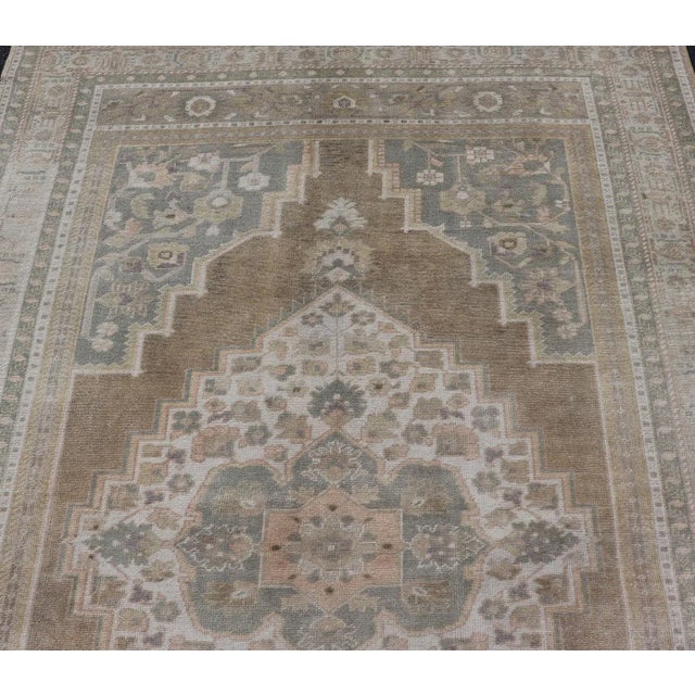 Textile Mid 20th Century Mid 20th Century Vintage Turkish Oushak Rug From Turkey With Muted Colors and Floral Medallion For Sale - Image 7 of 12