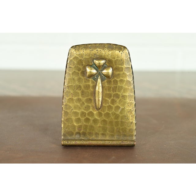 A gorgeous Arts & Crafts period brass finished hand hammered copper bookend By Roycroft (signed with impressed orb and...