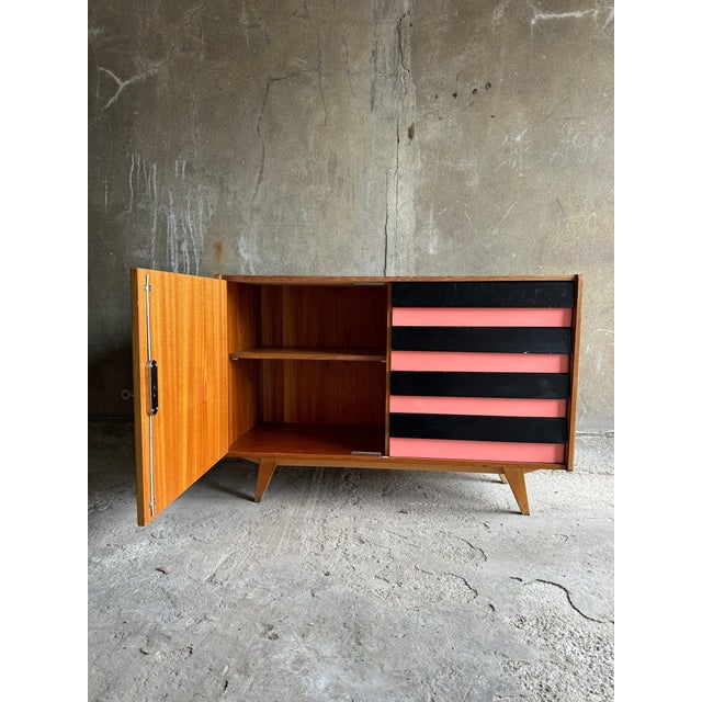 this sideboard is part of the famous universal series ( u-450 ) designed in 1958 by jiri jiroutek for the czechoslovak...