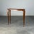 Refined Italian console table by Pierluigi Colli, produced in Italy in the 1950s. Crafted in solid walnut with walnut...