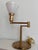 A beautiful Walter Von Nessen swing arm lamp in brushed brass with a milk glass diffuser. A perfect mid-century piece for...