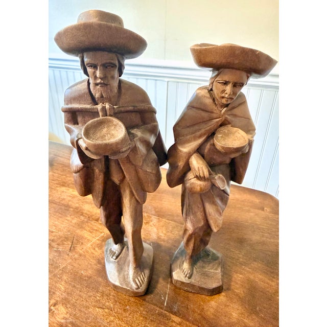 During the mid 20th century, a time when craft intertwined beautifully with cultural traditions, these wooden figures were...
