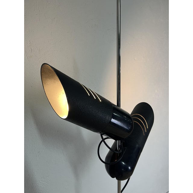 Floor lamp with black metal spotlights and a chrome stem, Galdino model, designed by Carlo Urbinati for Guzzini in the...