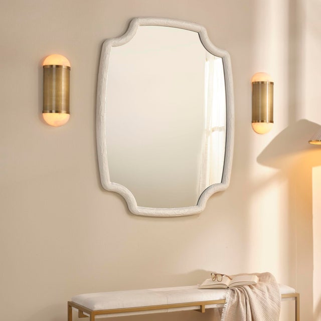 This sconce's timeless silhouette is enhanced with artisan-crafted quality and updated with sumptuous materials. Each is...