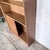 A beautifully proportioned mid-century teak sliding door bookcase by herbert gibbs, combining elegant british...