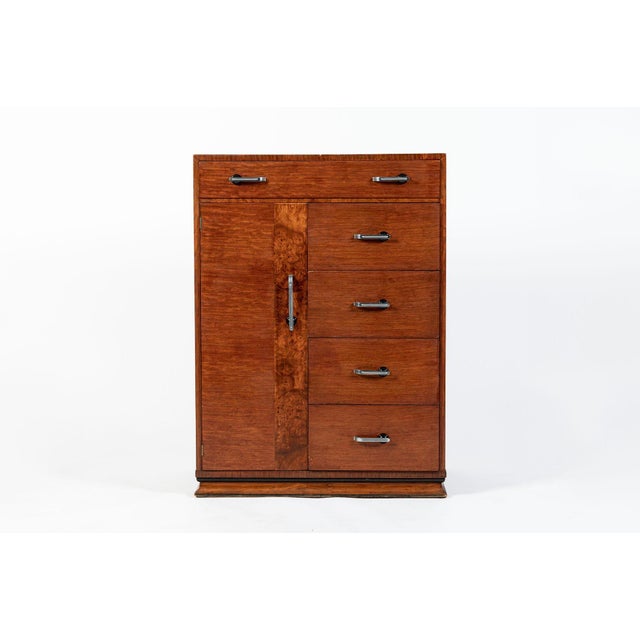 This antique Art Deco wooden dresser chest by Williamsport is circa 1940. This unique has a clean, geometric form and...