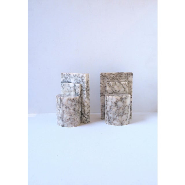 A pair of Italian alabaster marble bookends, Art Deco Modern design, circa mid-20th century, Italy. Pair are off-white...