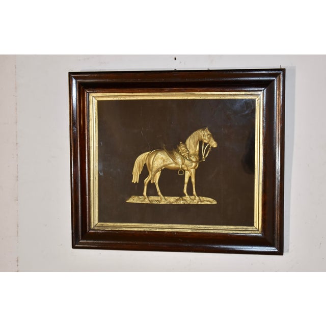 This gilt bronze plaque featured in a shadowbox is of the famous circus horse "Black Eagle", and was made and framed circa...