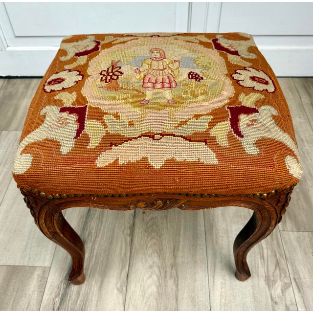Here is an antique French Louis XV style footstool dating to approximately the turn of the 20th century, with a...
