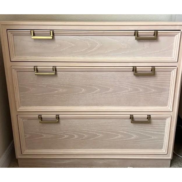 A beautifully finished pair of Drexel nightstands / chests of drawers featuring a light cerused oak finish that highlights...