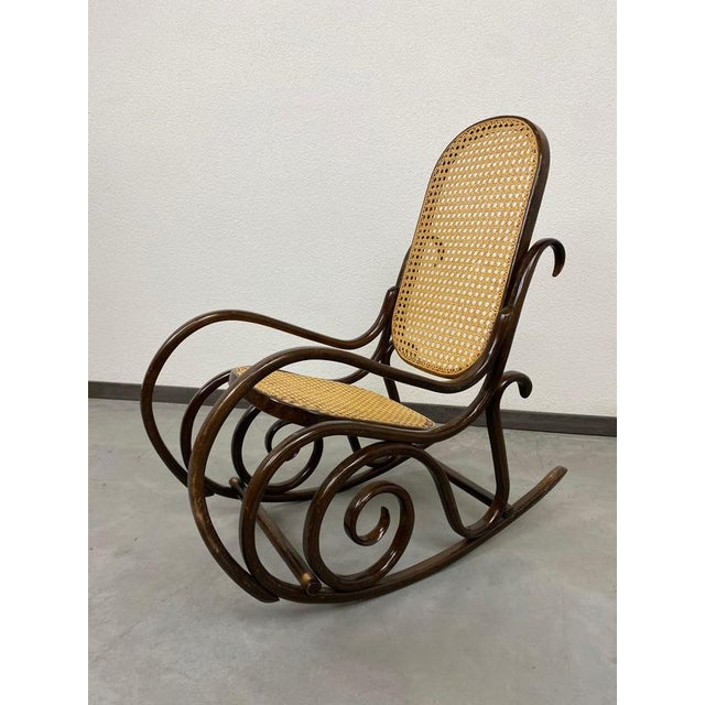 Small Thonet rocking chair no.10 for children. This piece is attributed to the mentioned designer/maker. It has no...