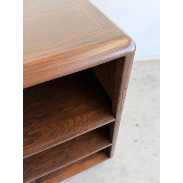 W56.5 D18 H51.5 Vintage oak bookcase, newly refinished to highlight the natural grain and warm tone of the wood. Features...