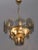 This 6 light chandelier, gilded metal structure with 18 discs with a diameter of 14.5 cm, the discs were made of smoked...