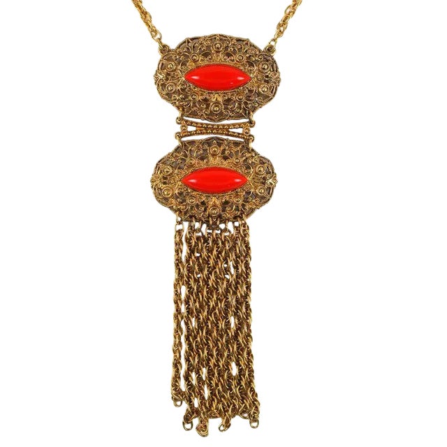 This is part of Chairish’s Costume Jewelry assortment. Double medallion fringed pendant necklace with faux coral...
