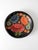 Vintage hand-painted wooden bowl featuring layered folk-art florals in rich shades of red, blue, orange, and cream against...