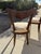 Elegant pair of vintage Regency Revival dining or side chairs, crafted in richly finished wood and distinguished by...
