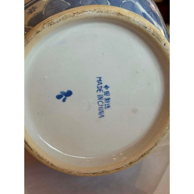 Large blue and white Chinoiserie Vase with floral and bird motif designs. Delicate decorative design around the rim...