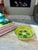 A vibrant 8-inch Italian art pottery ashtray/ catchall featuring a bold lava glaze texture and a hand-painted geometric...