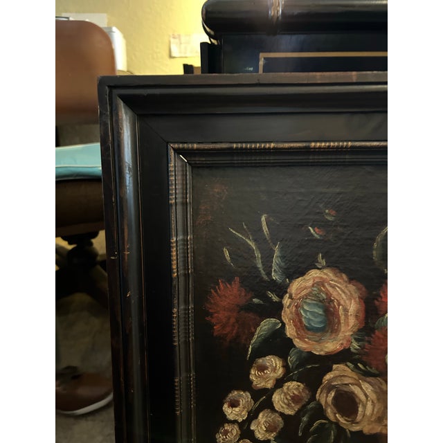 Charming 19th century oil painting on canvas of a still life with flowers presented in the original wood frame.