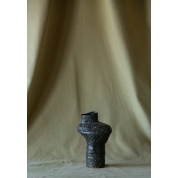 This handcrafted ceramic vase is created by contemporary artist, Jenny Rice, in Portland, Oregon using a coil building...