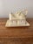 A beautiful Belleek covered butter dish depicting a rustic Irish cottage marked with the 7th Gold/Brown seal from 1980-1992.